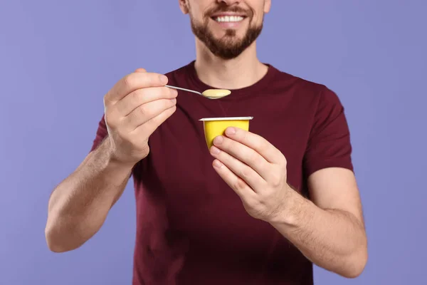 Man Tasty Yogurt Purple Background Closeup — Stock Photo, Image