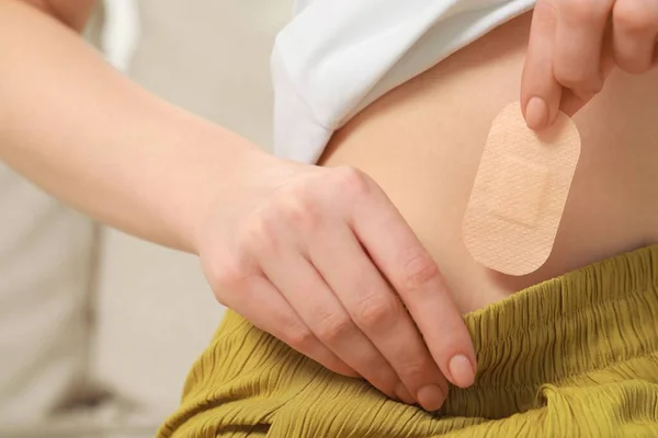 Woman Applying Contraceptive Patch Her Body Closeup — Stok fotoğraf
