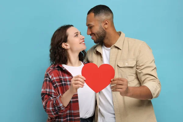 Lovely Couple Red Paper Heart Light Blue Background Valentine Day — Stock fotografie