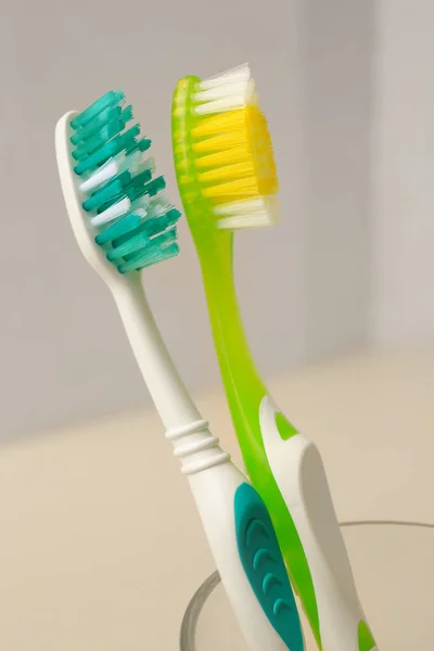 New Toothbrushes Glass Holder Blurred Background Closeup — Stock Photo, Image