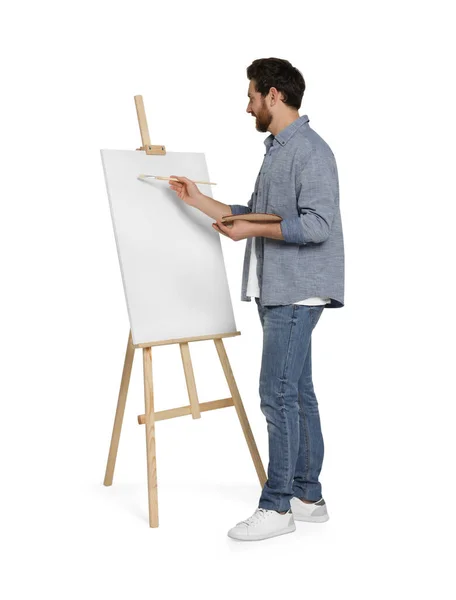 Mężczyzna Malowaniem Pędzlem Białym Tle Używając Sztalugi Trzymania Płótna — Zdjęcie stockowe