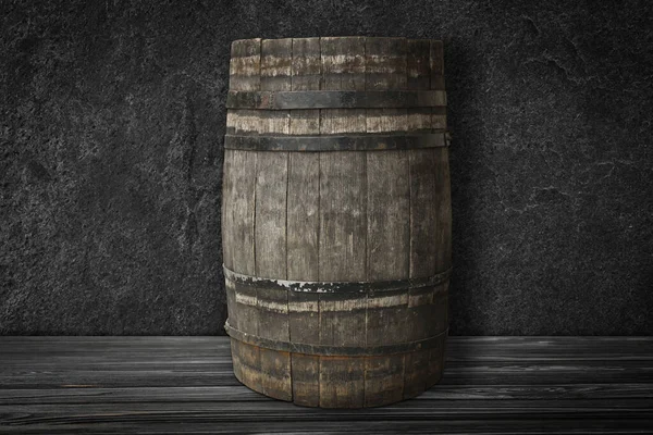 暗いテクスチャの壁の近くの黒い表面上の1本の木製の樽 — ストック写真