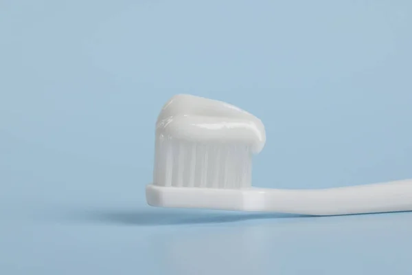 Plastic Toothbrush Paste Light Blue Background Closeup — Stock Photo, Image