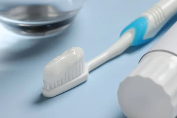 Plastic Toothbrush Paste Tube Light Background Closeup — Stock Photo, Image