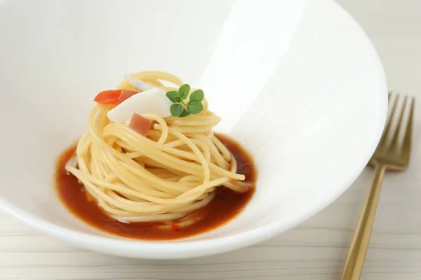 stock image Tasty spaghetti with sauce served on white wooden table, closeup. Exquisite presentation of pasta dish