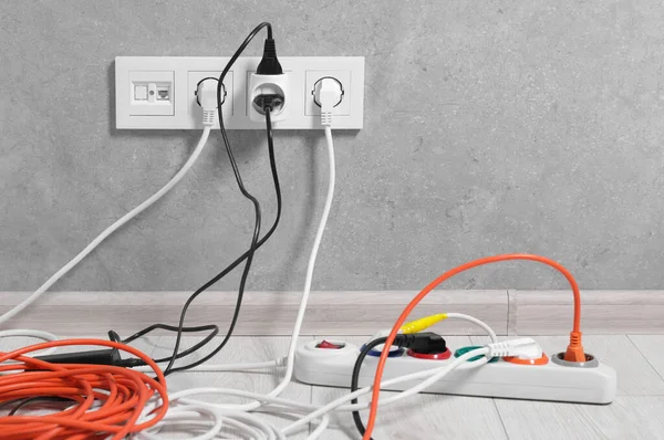 stock image Extension cord with power plugs in sockets indoors, space for text