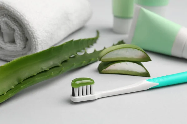 Toothbrush Toothpaste Towel Fresh Aloe Light Grey Background Closeup — Stock Photo, Image