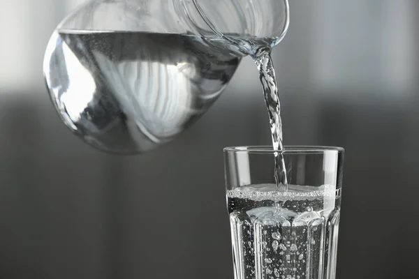Pouring Water Jug Glass Blurred Background Closeup — Stock Photo, Image
