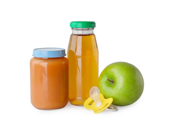 stock image Healthy baby food, pacifier and bottle with juice on light grey background