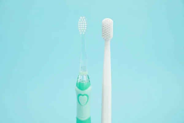 Electric Plastic Toothbrushes Light Blue Background Dental Care — Stock Photo, Image