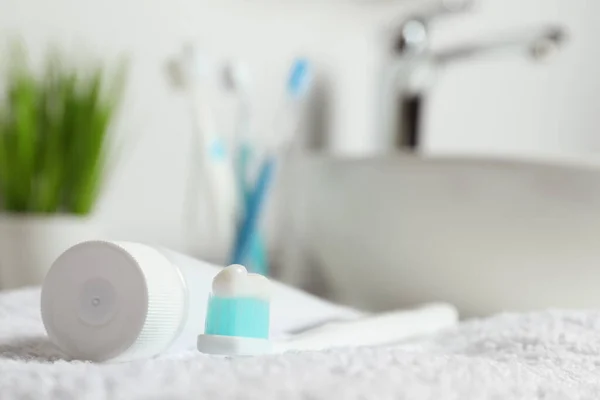 Plastic Toothbrush Paste Tube White Towel Bathroom Closeup Space Text — Stock Photo, Image