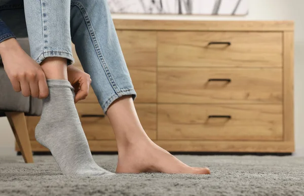 Woman Putting Grey Socks Home Closeup Space Text — Stock Photo, Image