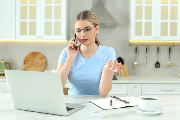 Home Workplace Woman Talking Smartphone Laptop Marble Desk Kitchen — Stock Photo, Image