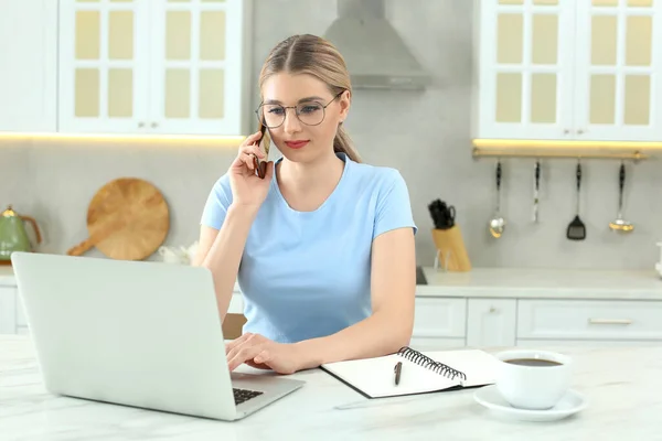 Home Workplace Woman Talking Smartphone Laptop Marble Desk Kitchen — Stock Photo, Image