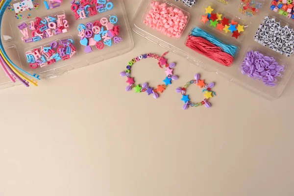 Handmade Jewelry Kit Kids Colorful Beads Wristbands Bracelets Beige Background — Stock Photo, Image