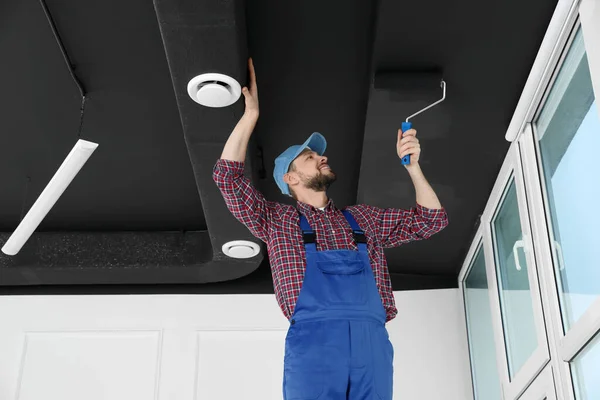 Worker Uniform Painting Ceiling Roller Indoors Low Angle View — Stock Photo, Image