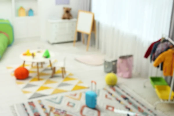 Размытый Вид Детской Игровой Комнаты Различными Игрушками Мебелью Стильный Интерьер — стоковое фото