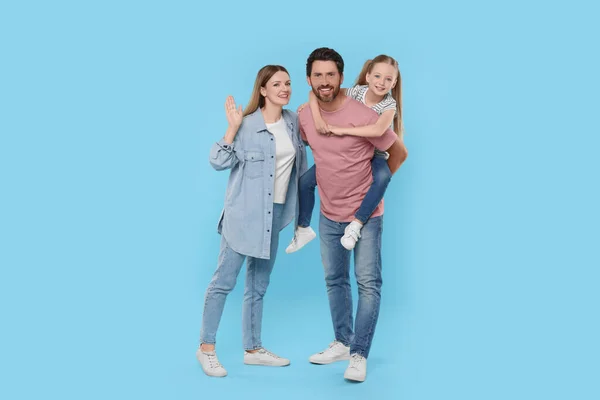 Lycklig Familj Tillsammans Ljusblå Bakgrund — Stockfoto