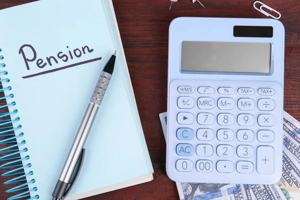 Calculator Notebook Word Pension Pen Dollar Banknotes Wooden Table Flat — Stock Photo, Image