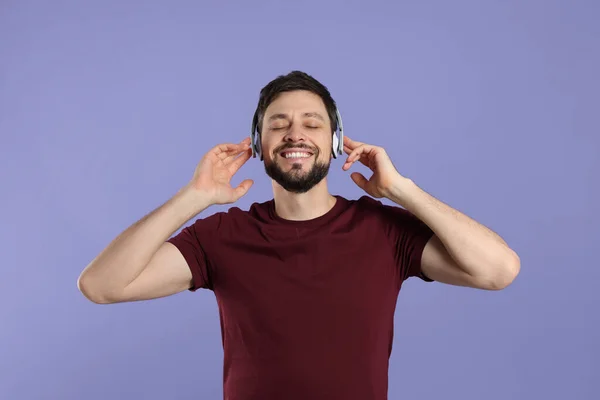 Happy Man Headphones Enjoying Music Purple Background — Stock Photo, Image