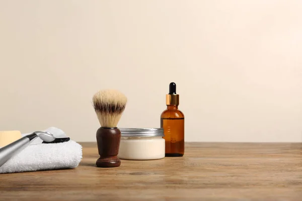 stock image Set of men's shaving tools on wooden table, space for text