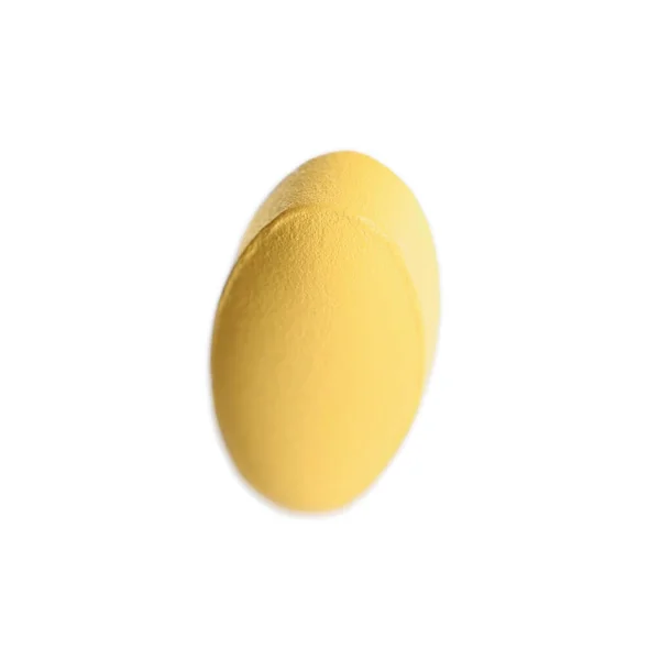 Jedna Jasnopomarańczowa Tabletka Wyizolowana Białym — Zdjęcie stockowe
