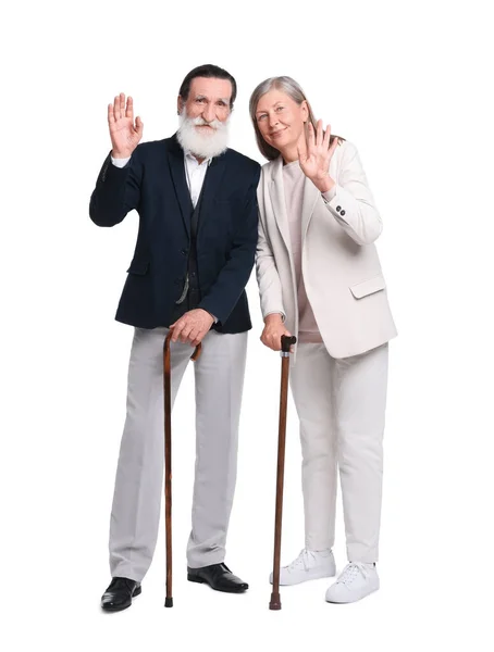 老男人和女人带着手杖在白色的背景上摇曳 — 图库照片