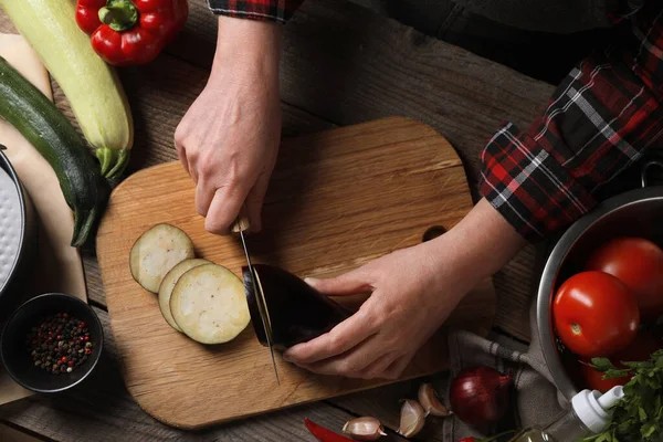 Cooking Delicious Ratatouille Woman Cutting Fresh Eggplant Wooden Table Top — Stock Photo, Image