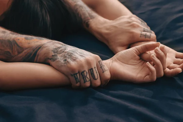 Stock image Passionate couple having sex on bed, closeup of hands