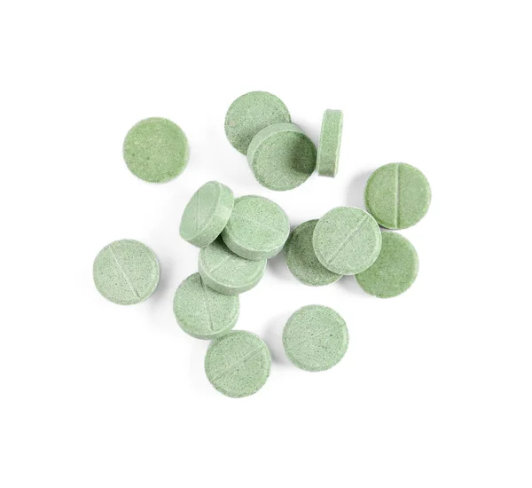 stock image Pile of green pills on white background, top view