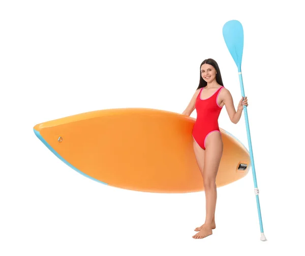 Happy woman with orange SUP board and paddle on white background