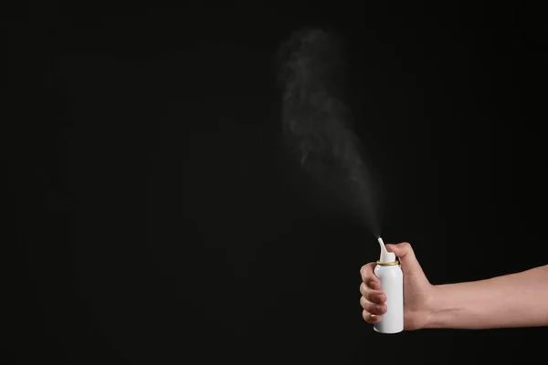 Nasal Congestion Woman Spraying Remedy Bottle Black Background Closeup Space — Stock Photo, Image