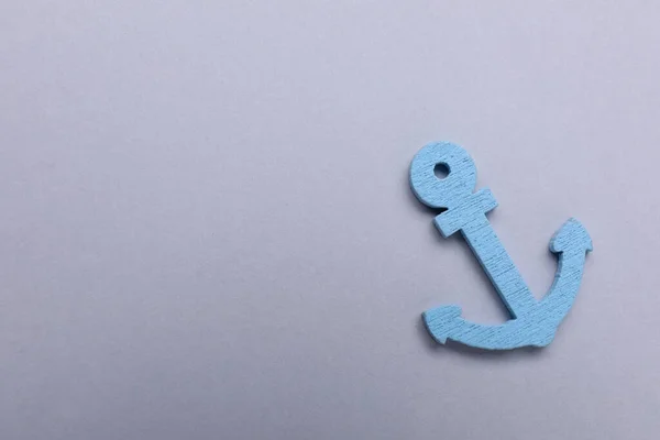 stock image Anchor figure on light grey background, top view. Space for text