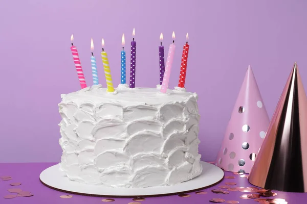 Delicious Cake Burning Candles Festive Decor Purple Background — Stock Photo, Image