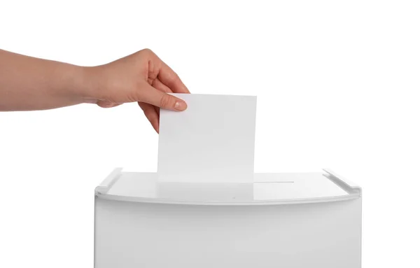 stock image Woman putting her vote into ballot box on white background, closeup