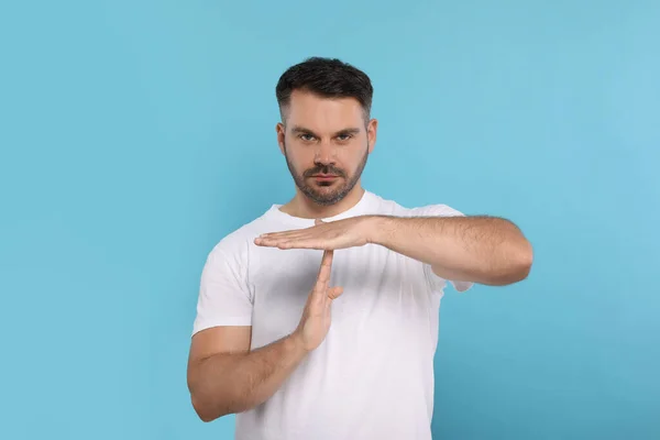Handsome Man Showing Time Out Gesture Light Blue Background Stop — Stock Photo, Image
