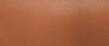 Arkaplan olarak parlak bronz yüzey, yakın görünüm