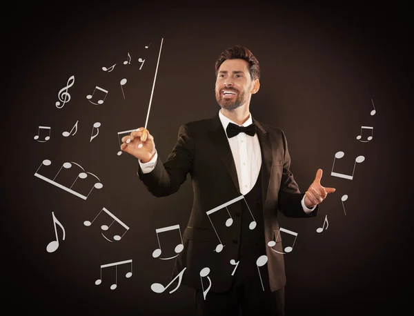 Conductor on dark background. Music notes flying from baton