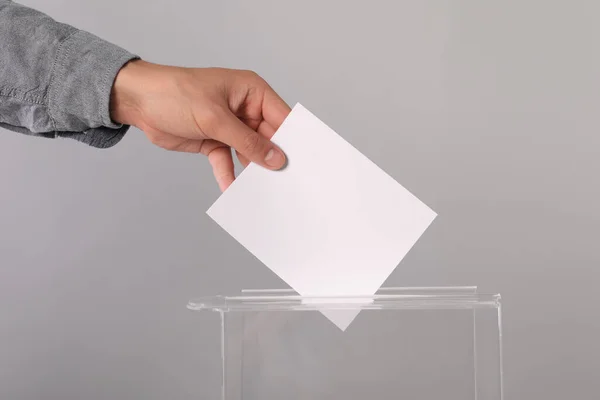 Man Putting His Vote Ballot Box Light Grey Background Closeup — Stock Photo, Image