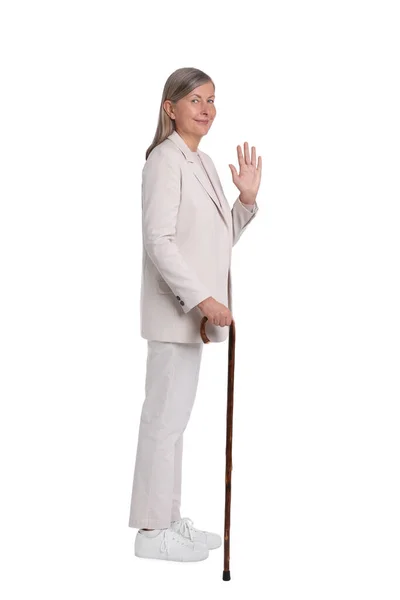 Mujer Mayor Con Bastón Ondeando Sobre Fondo Blanco — Foto de Stock