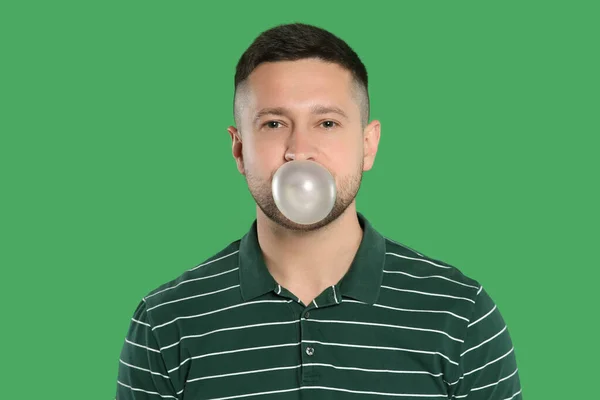 Handsome Man Blowing Bubble Gum Green Background — Stock Photo, Image
