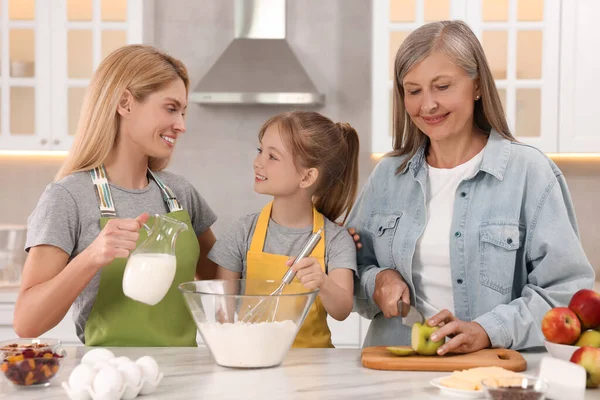 Three Generations Happy Grandmother Her Daughter Granddaughter Cooking Together Kitchen — стоковое фото