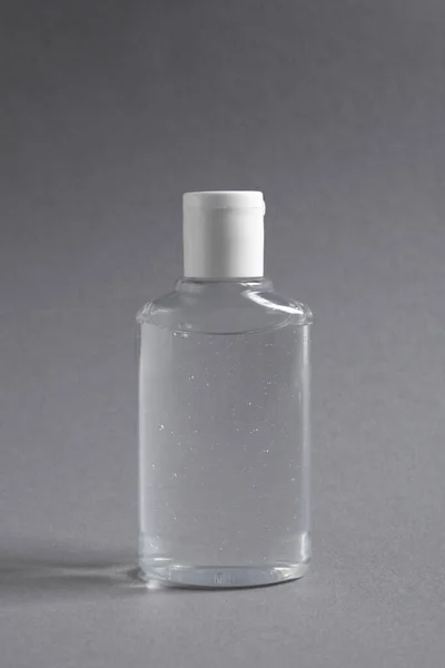 Прозрачная Бутылка Косметическим Продуктом Сером Фоне — стоковое фото