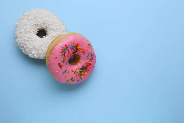 Tasty Glazed Donuts Decorated Coconut Shavings Sprinkles Light Blue Background — Stock Photo, Image