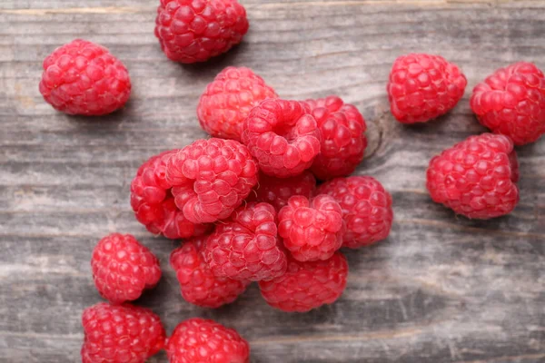 stock image Tasty ripe raspberries on wooden table, top view