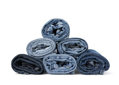 Different stylish rolled jeans isolated on white