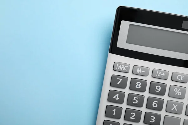 Calculator Light Blue Background Top View Space Text — Stock Photo, Image