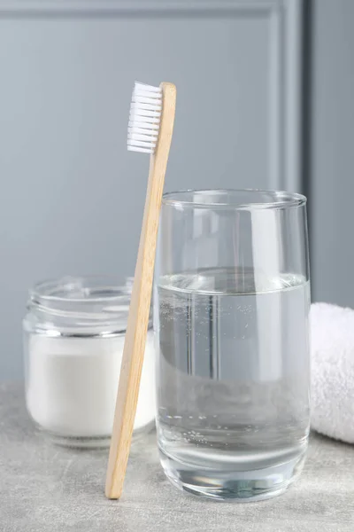 Bamboo Toothbrush Glass Water Jar Baking Soda Light Grey Table — Stock Photo, Image
