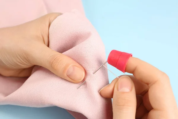 Woman Sewing Pink Fabric Thimble Needle Light Blue Background Closeup — Stock Photo, Image
