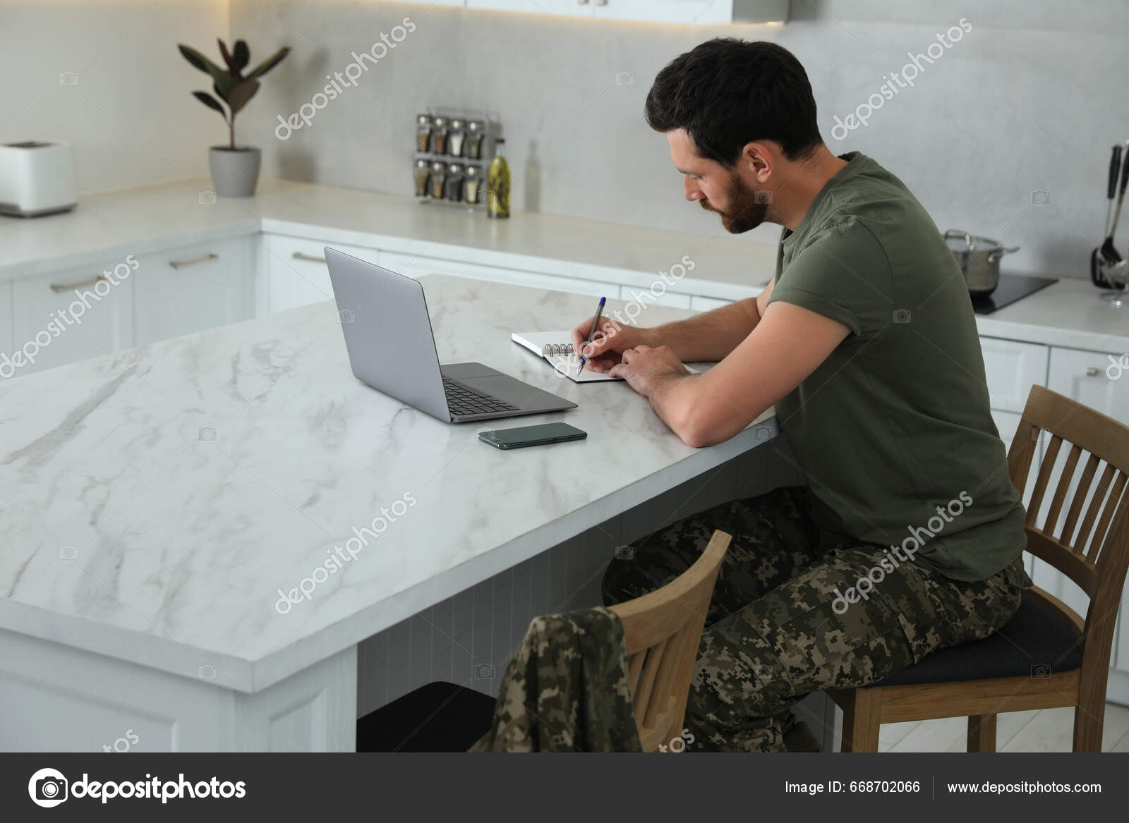 Soldier Taking Notes While Working Laptop White Marble Table Kitchen ...